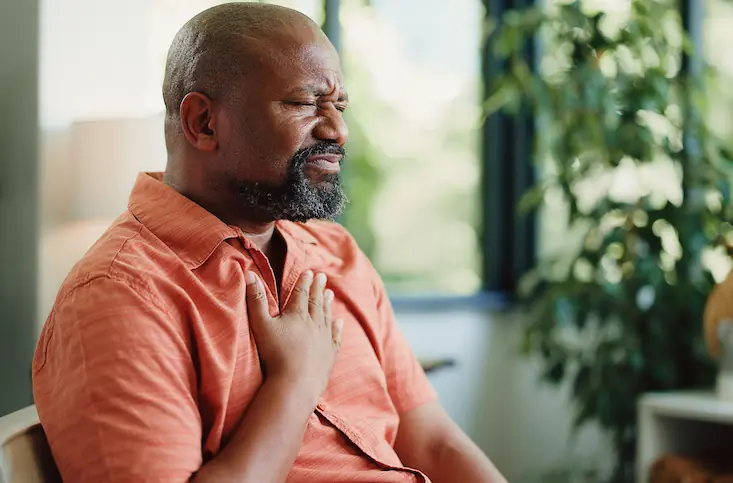 man suffering from reflux